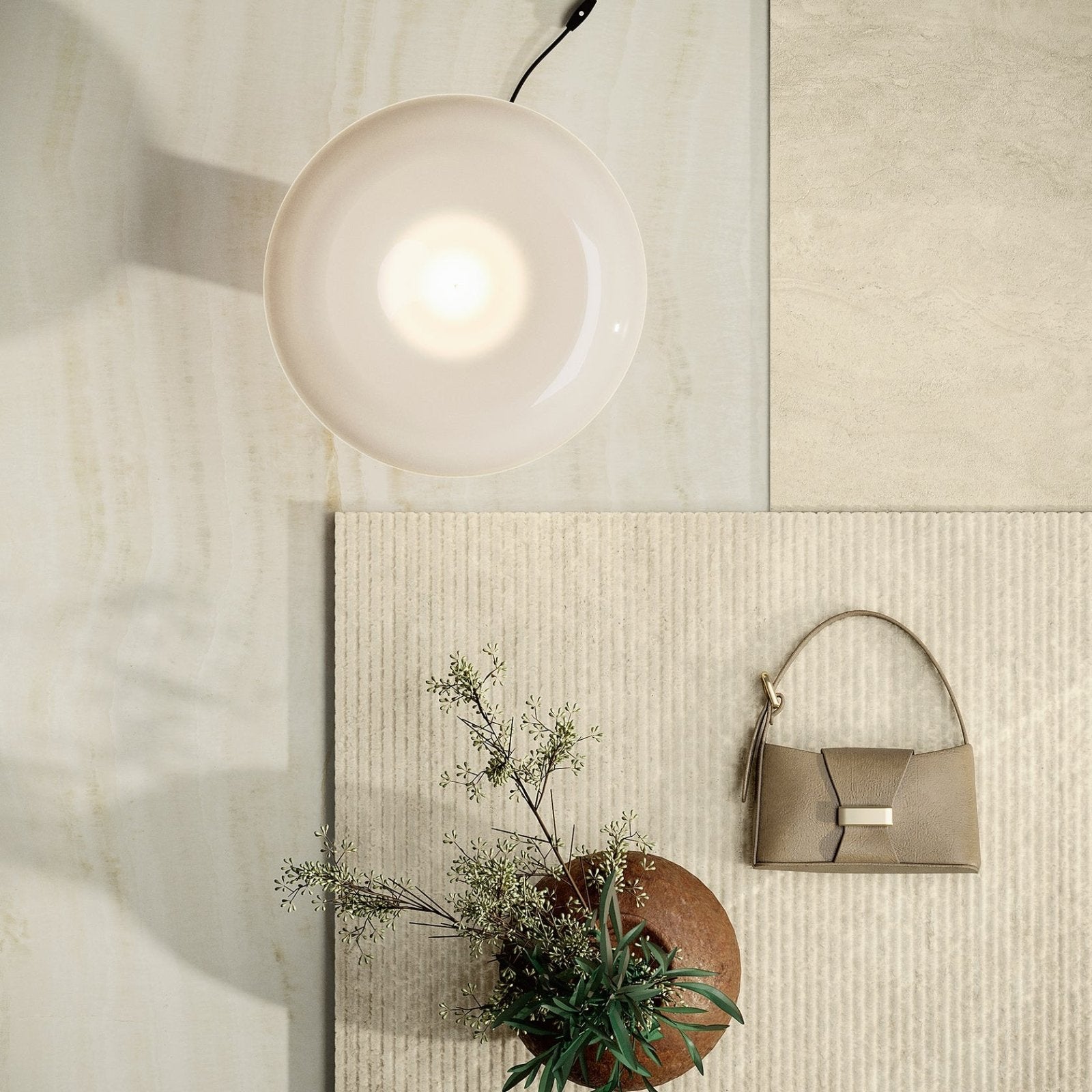 Marvel Epic Onyx Ivory ivory marble-effect tile with a beige leather handbag