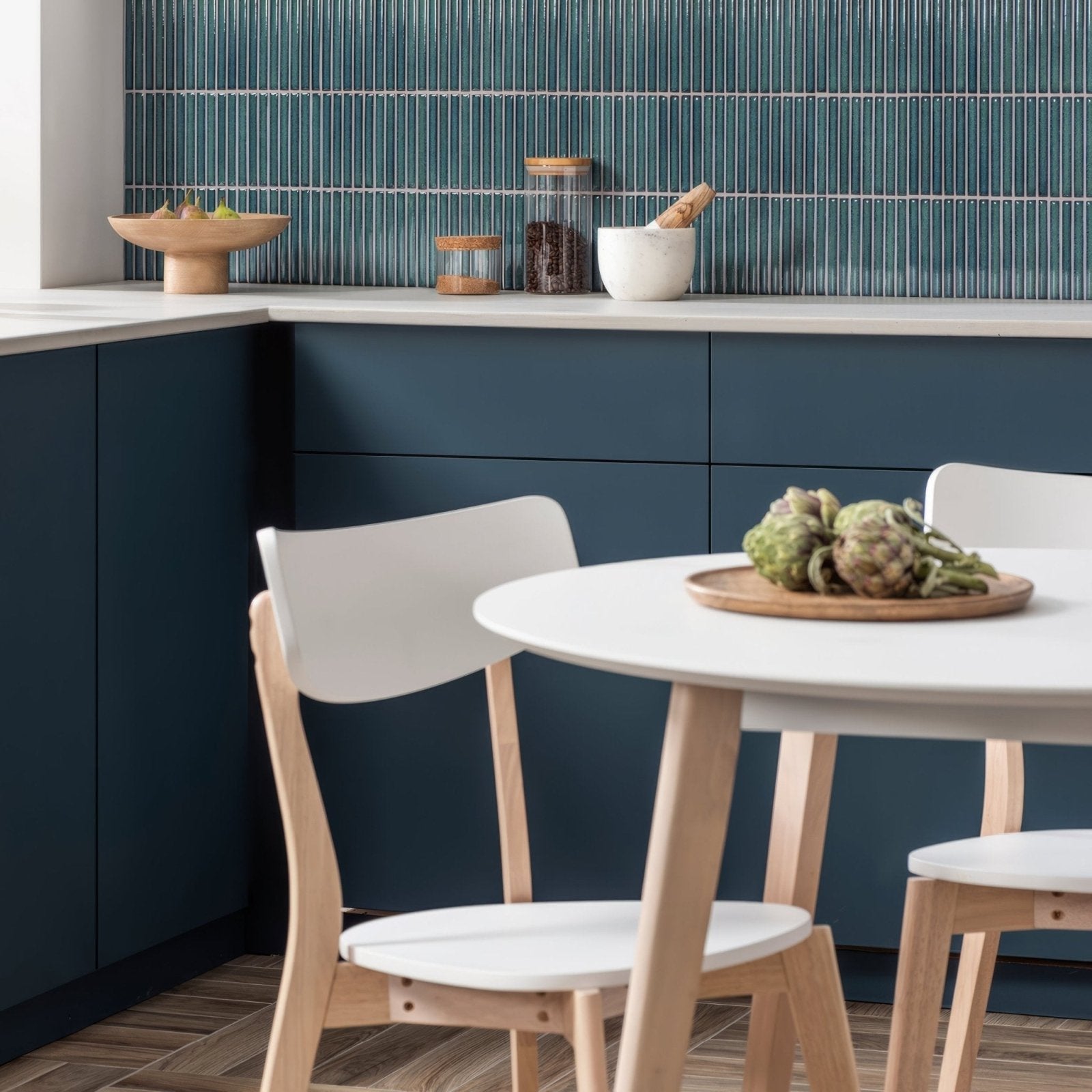 Matchstick Forest teal glass mosaic with a white round dining table