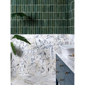 Dark green rectangular ceramic tiles with white grout create a modern wall accent above medici viola marble honed brick vanity
