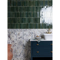 Deep green glossy rectangular medici viola marble honed brick tiles arranged in a vertical grid pattern