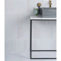 White rectangular porcelain subway tiles with smooth glossy finish on bathroom wall Medina Brick Porcelain Latte