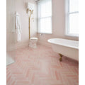 Pink herringbone patterned medina brick porcelain rosa floor tiles showcasing a durable stylish surface design