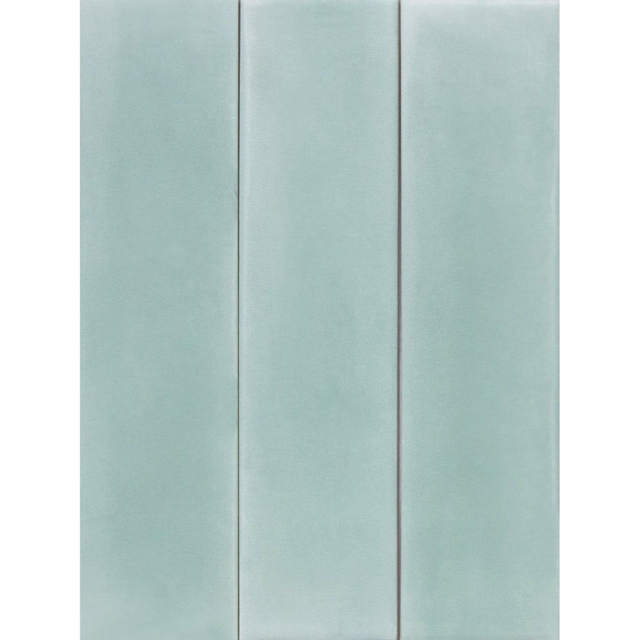 Three vertical mint green porcelain tiles with a smooth glossy finish from Medina Brick Salvia collection