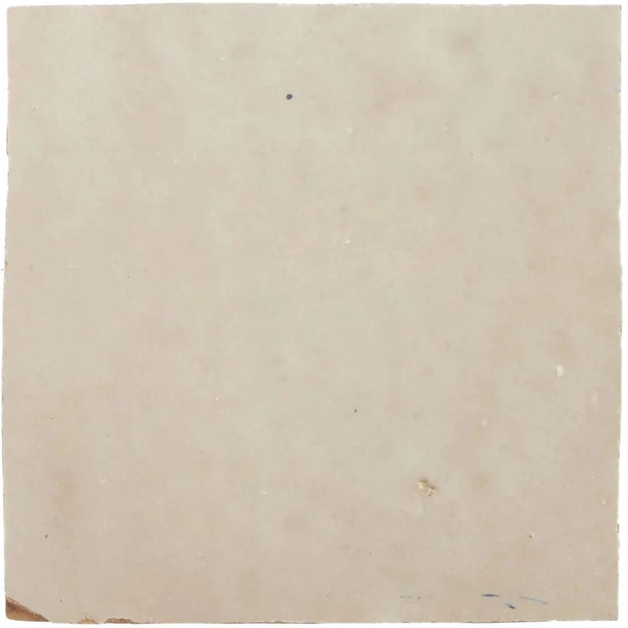 Cream-colored slightly textured square handmade Moroccan zellige tile with subtle natural tone variations and imperfections