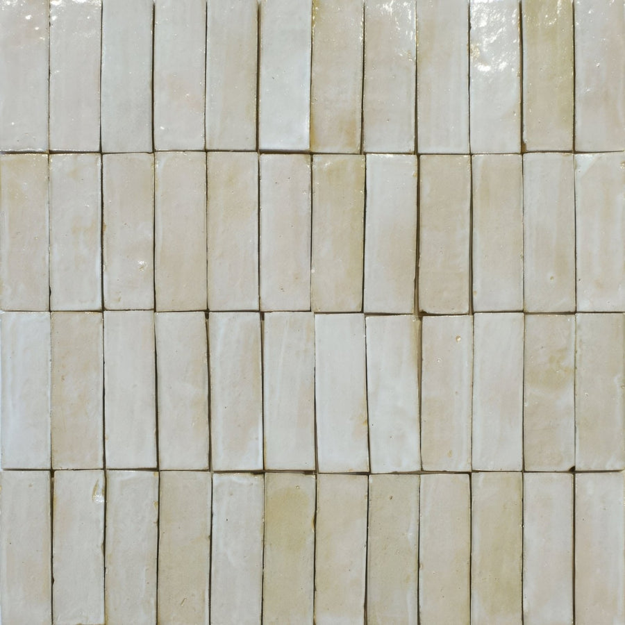 Rectangular off-white ceramic tiles with subtle glossy finish in neat rows medina cloudy white zellige rectangle