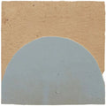A light gray semi-circular handmade moroccan zellige tile with a slightly textured surface from medina cornflower blue belen collection