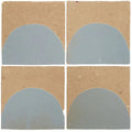 Four handcrafted Medina cornflower blue zellige tiles with tan textured background and matte semicircular design
