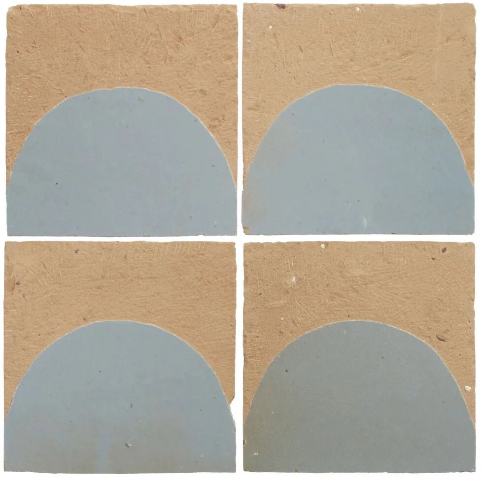 
Four handcrafted Medina cornflower blue zellige tiles with tan textured background and matte semicircular design