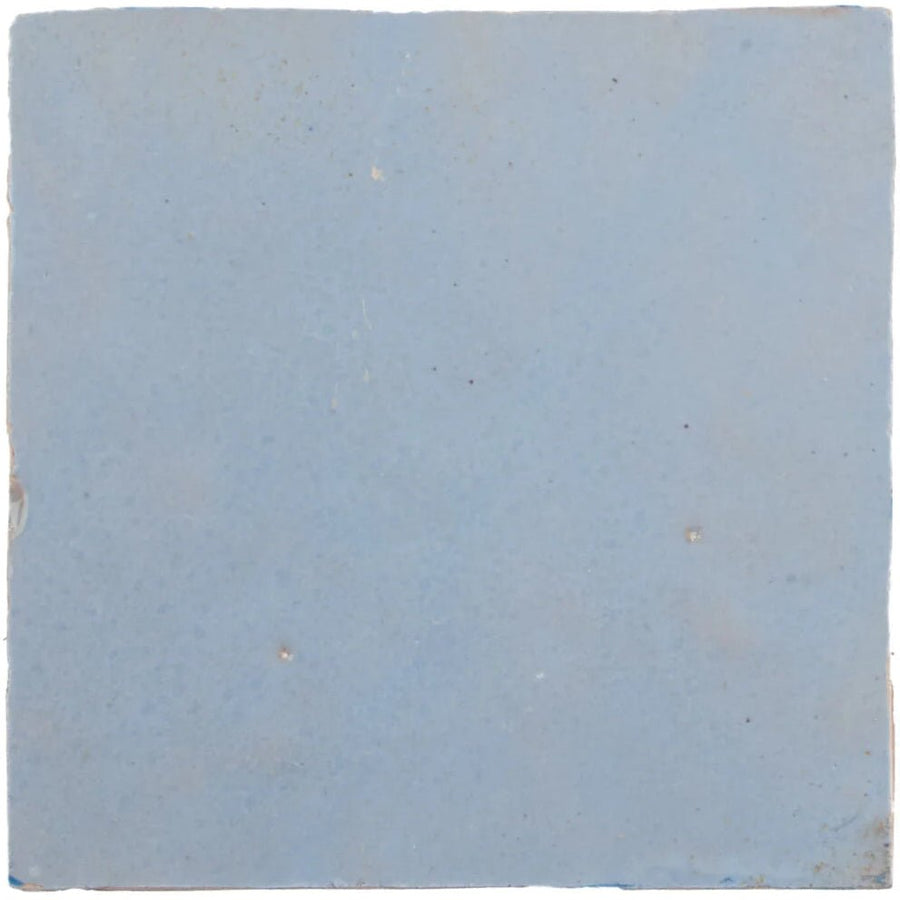 Medina cornflower blue square handmade moroccan zellige tile made of light blue ceramic with textured surface and imperfections