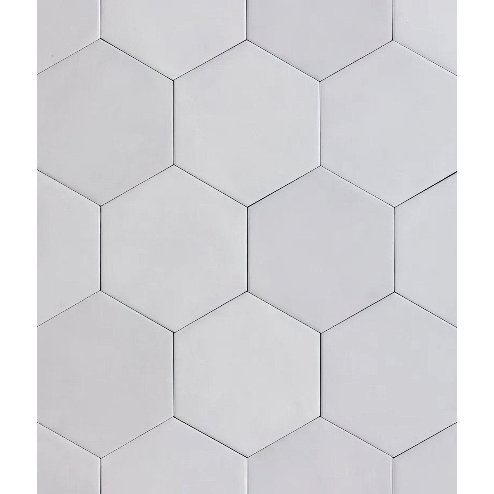 Medina hexagon porcelain latte white hexagonal tiles with smooth matte finish arranged in a geometric pattern
