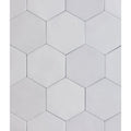 Medina hexagon porcelain latte white hexagonal tiles with smooth matte finish arranged in a geometric pattern