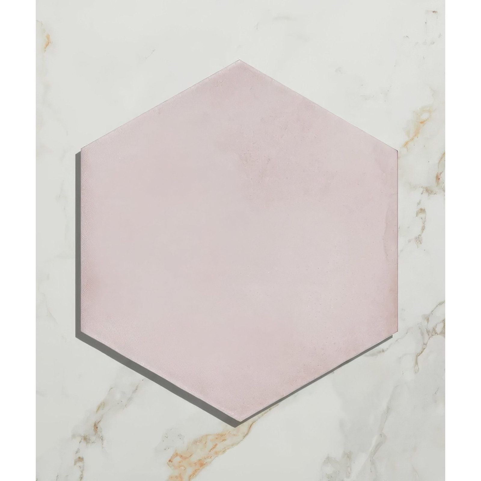 A soft pink hexagonal porcelain tile medina hexagon rosa with a matte finish and subtle texture