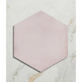 A soft pink hexagonal porcelain tile medina hexagon rosa with a matte finish and subtle texture
