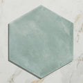 Medina hexagon porcelain tile with matte muted teal finish and subtle texture in salvia color