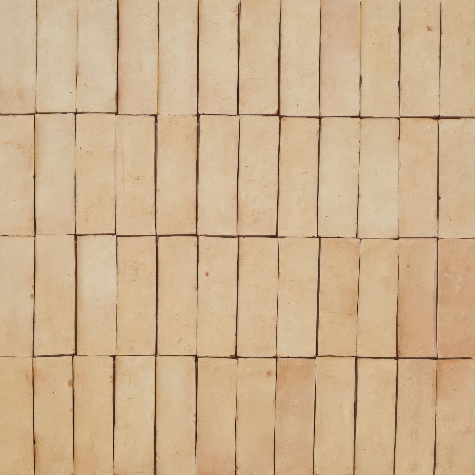 Beige rectangular zellige tiles arranged in a grid pattern showcasing the medina raw zellige rectangle design