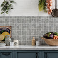 Gray medine patterned mosaic tile backsplash featuring intricate repeating geometric patterns for wall decor