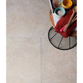 Beige stone-effect mediterranean porcelain floor tiles with subtle natural veining for durable indoor use