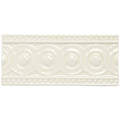 Cream-colored ceramic Melford Baroque tile with raised circular pattern and decorative beaded borders