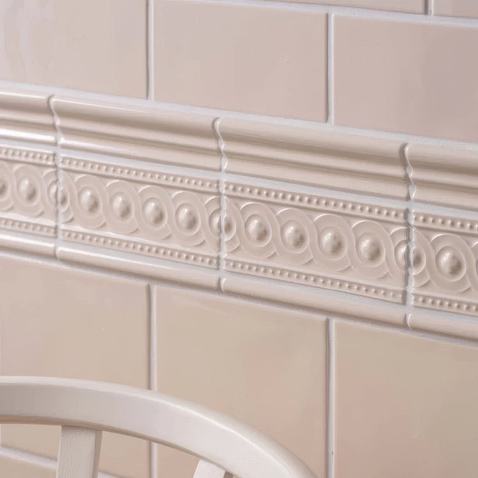 Beige ceramic tile border melford chelsea with raised circular and dot patterns for decorative edging