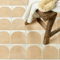 Beige menara cotto arches porcelain tiles with arched rounded tops and white grout lines in ceramic finish