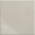 Cream-colored menara white porcelain gloss square tile with smooth slightly textured surface and subtle natural veining