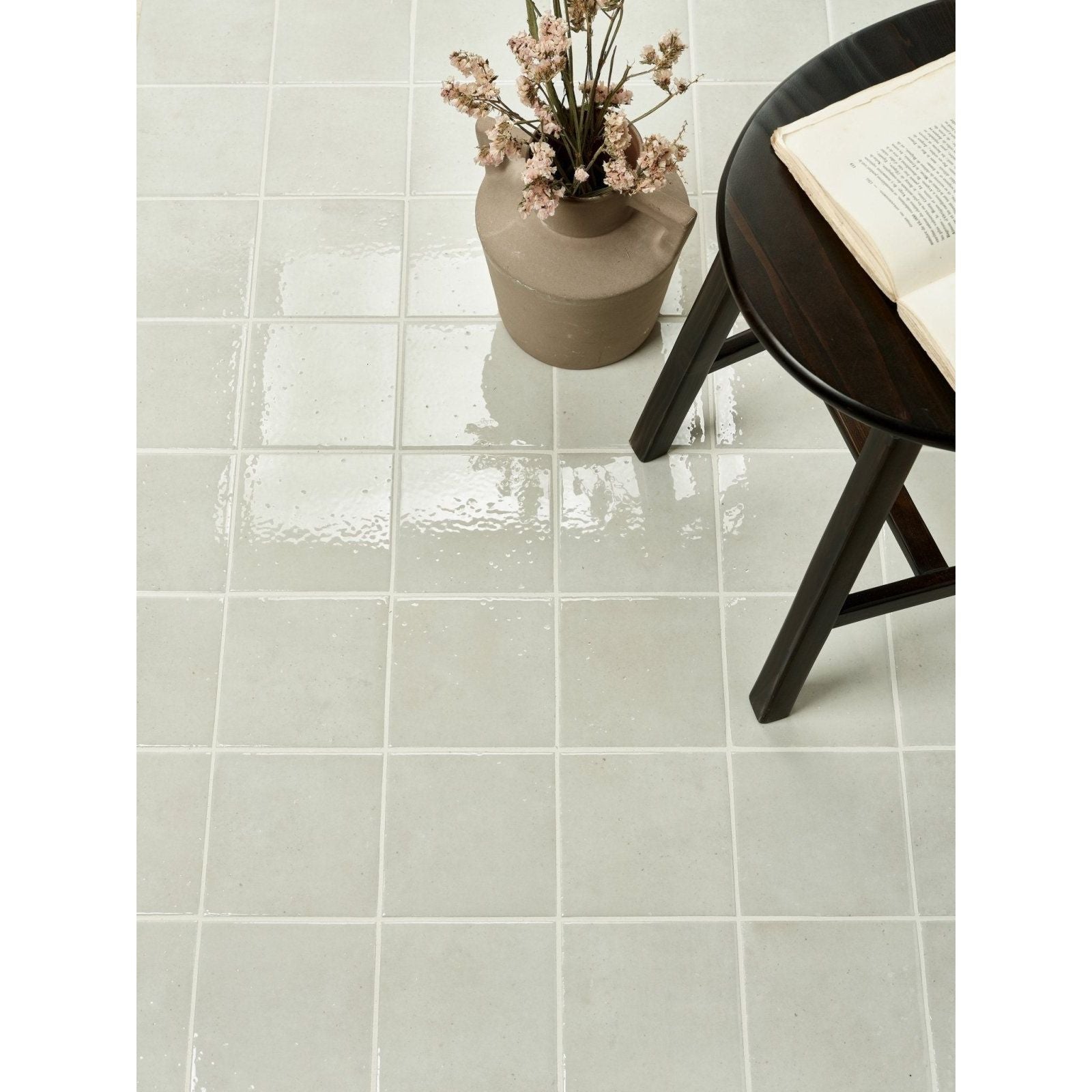 Light gray glossy menara white porcelain gloss ceramic floor tiles with subtle texture and white grout lines