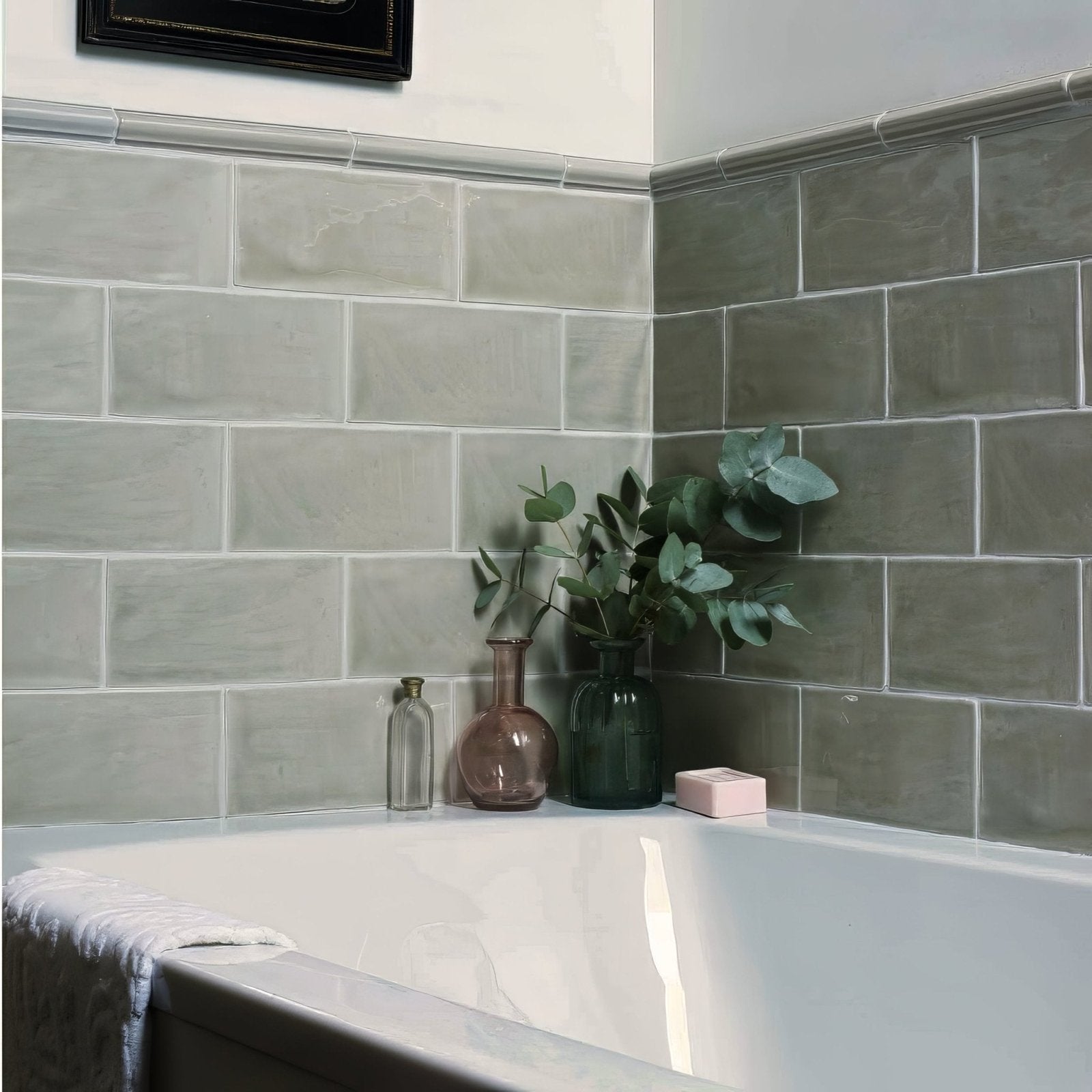 Gray mere brick tile ceramic rectangular tiles with subtle texture and matte finish lining a bathroom wall
