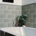 Gray mere brick tile ceramic rectangular tiles with subtle texture and matte finish lining a bathroom wall