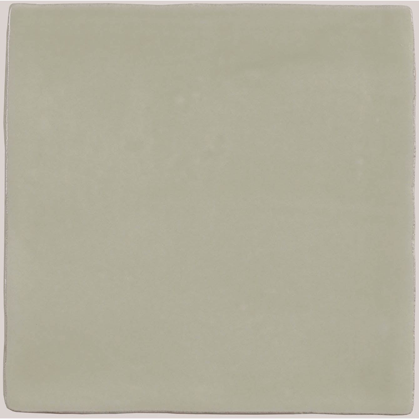 A square matte-finished ceramic tile in soft sage green from the mere field tile collection