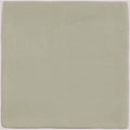 A square matte-finished ceramic tile in soft sage green from the mere field tile collection
