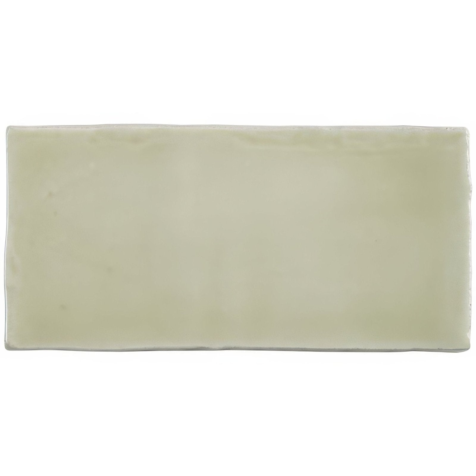Cream-colored ceramic mere half tile wall tile with smooth glossy finish and rectangular shape for wall use