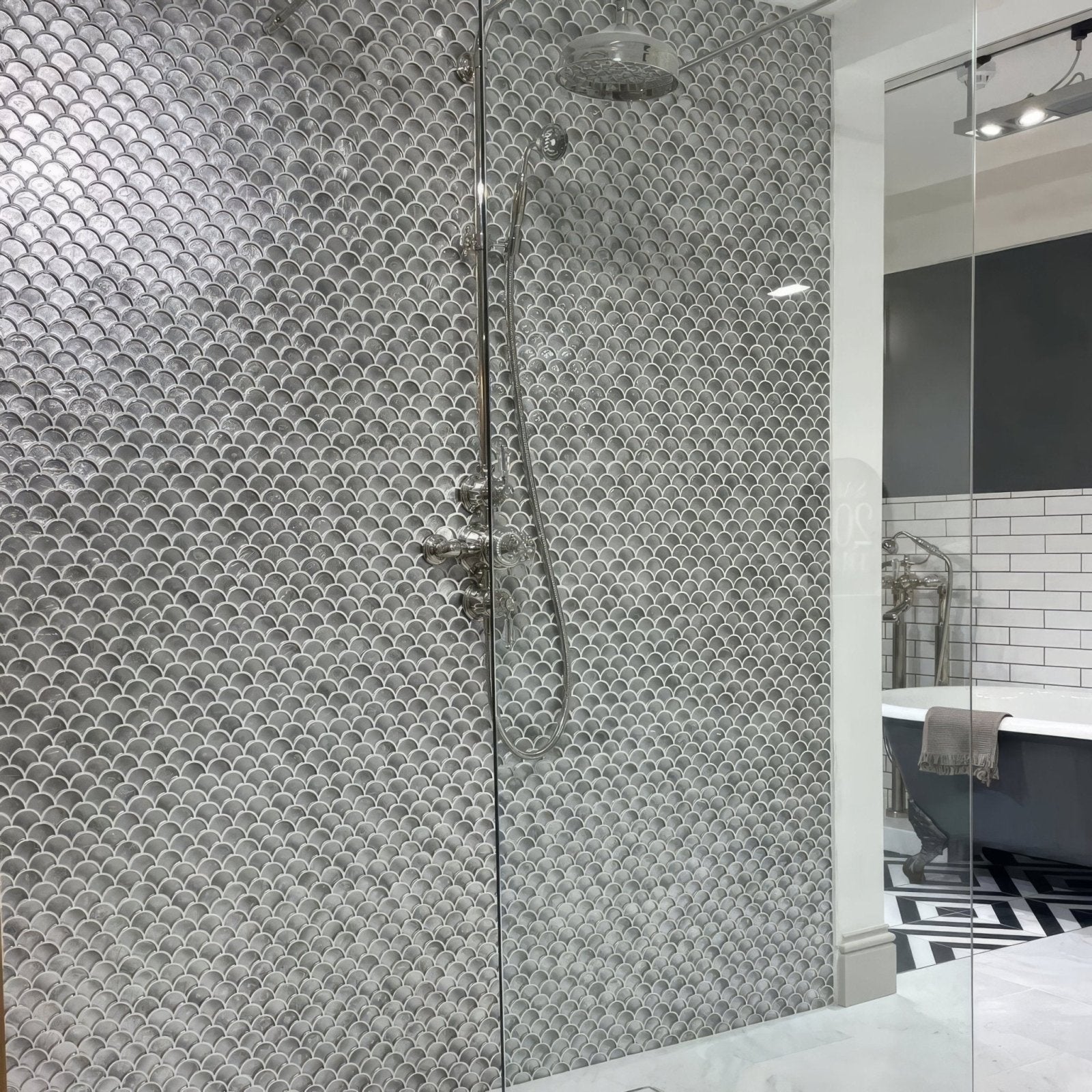 Shiny silver fish-scale mosaic tiles cover shower wall in metallic vitreum argentum fan silver glass tile design