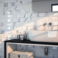 Metro Calacatta Gris Ceramic Gloss white marble-effect ceramic tiles with a white vessel sink