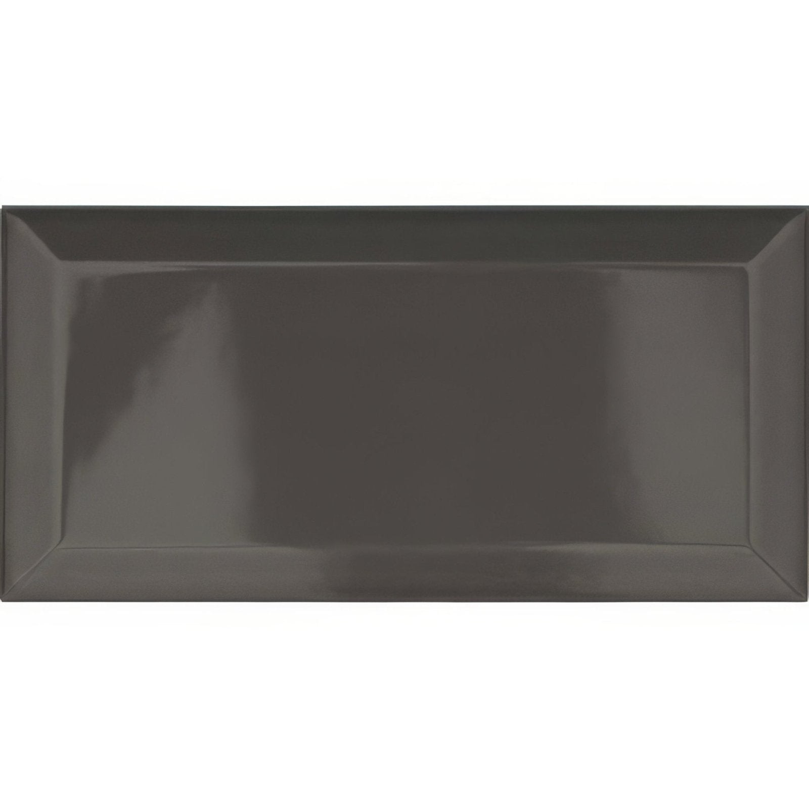 A sleek glossy charcoal gray ceramic tile with a subtle raised border from metro graphite ceramic gloss collection