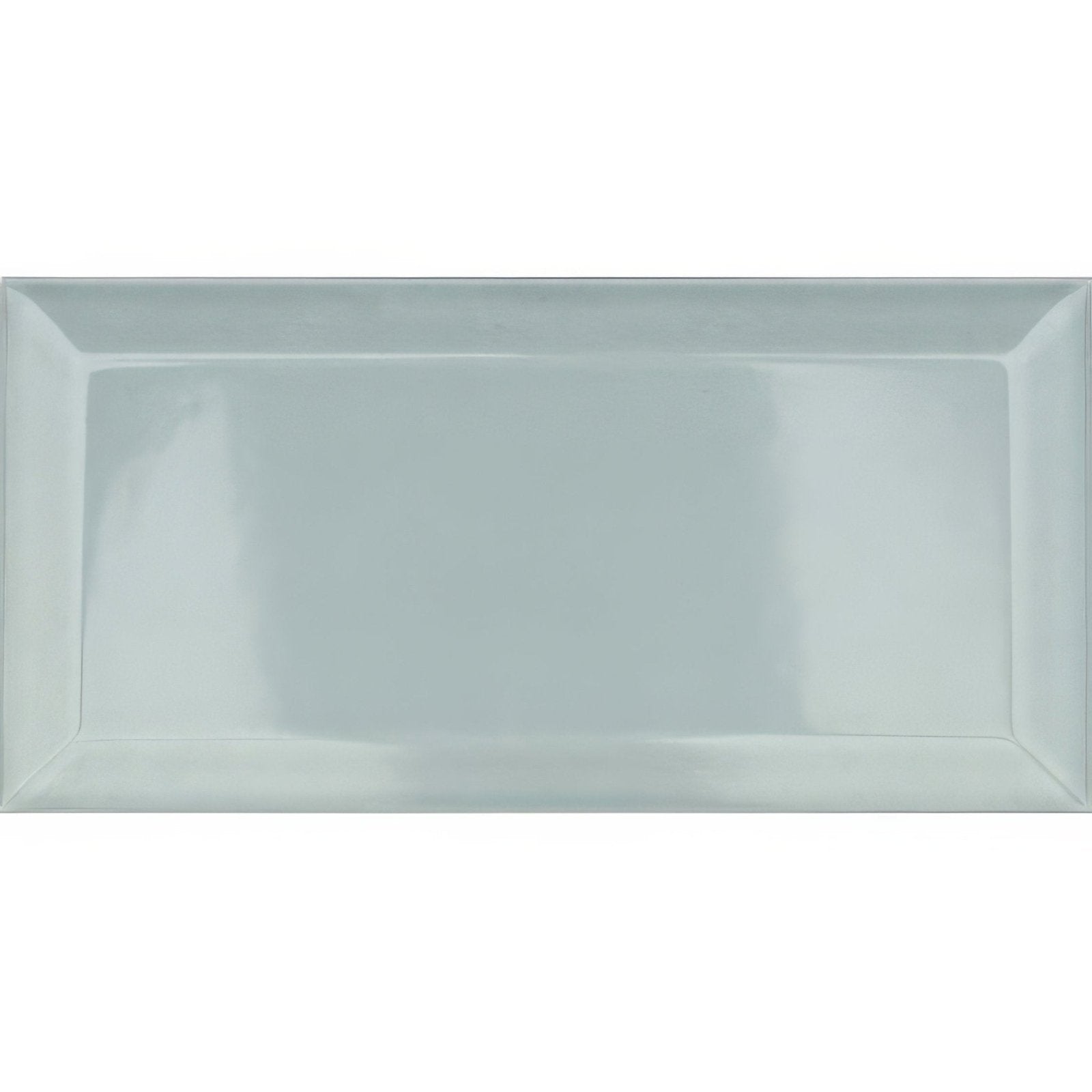 A sleek rectangular metro mint ceramic gloss tile with a glossy light gray finish and subtle raised edges