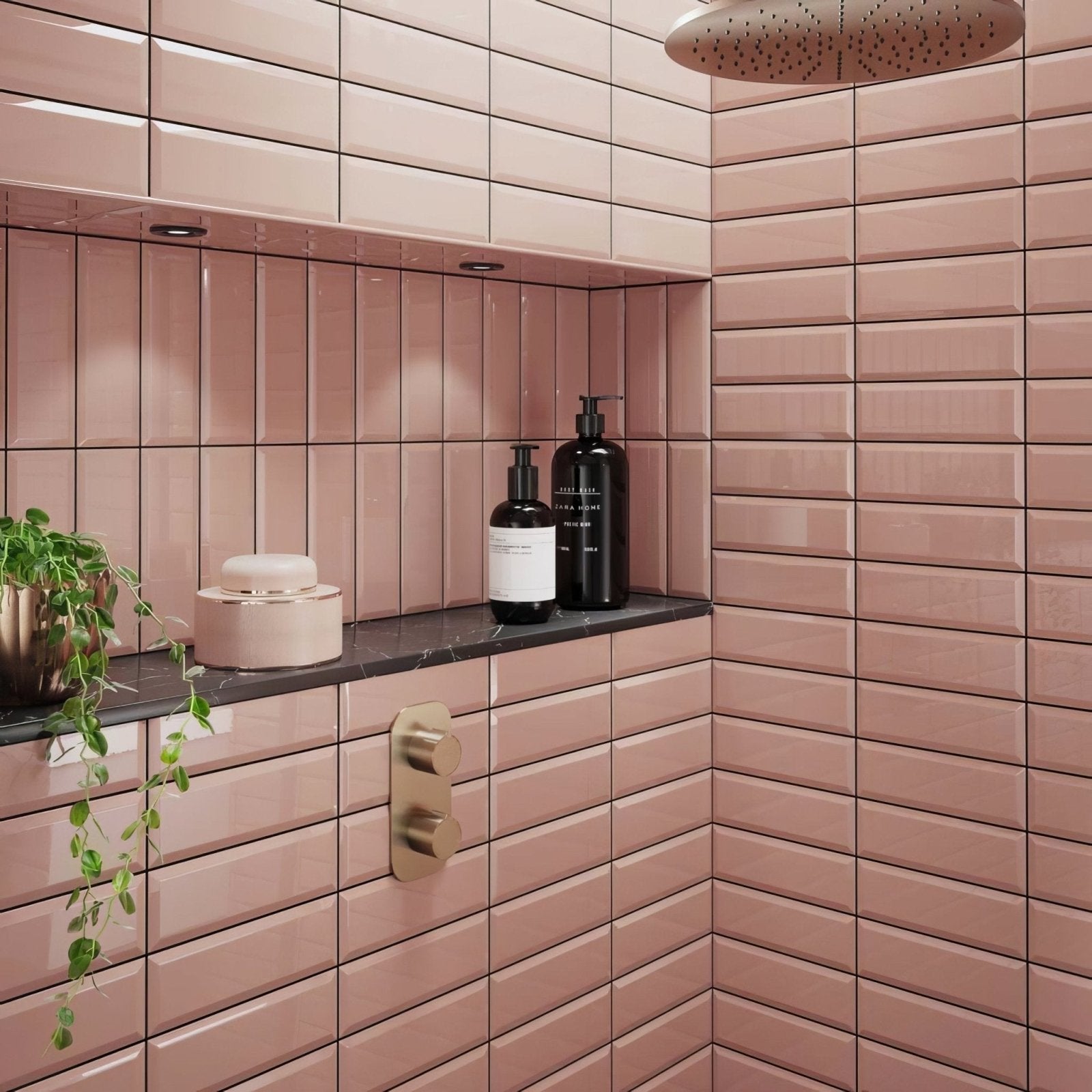 Pink rectangular metro ceramic brick tiles with glossy finish lining shower walls and built-in shelf