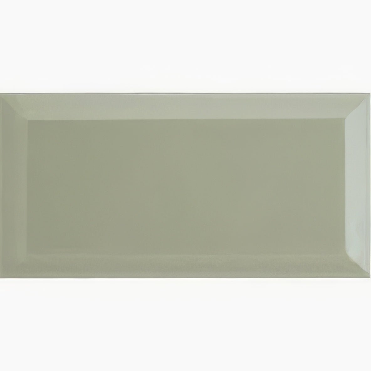 A sleek rectangular ceramic tile with a matte sage green finish and subtle beveled edges from Metro Sage Ceramic Gloss