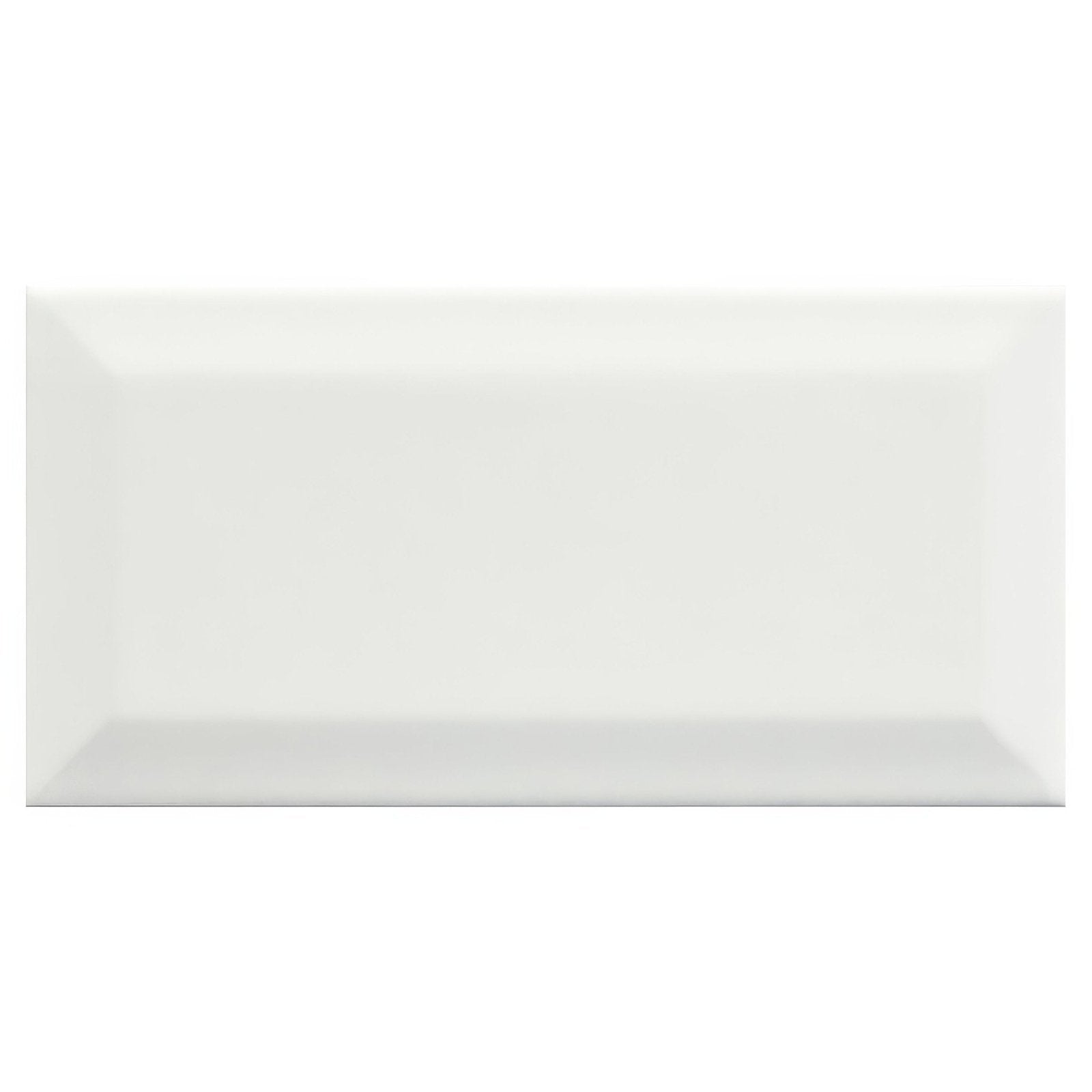 A sleek glossy white rectangular metro white ceramic gloss tile with a subtle beveled edge