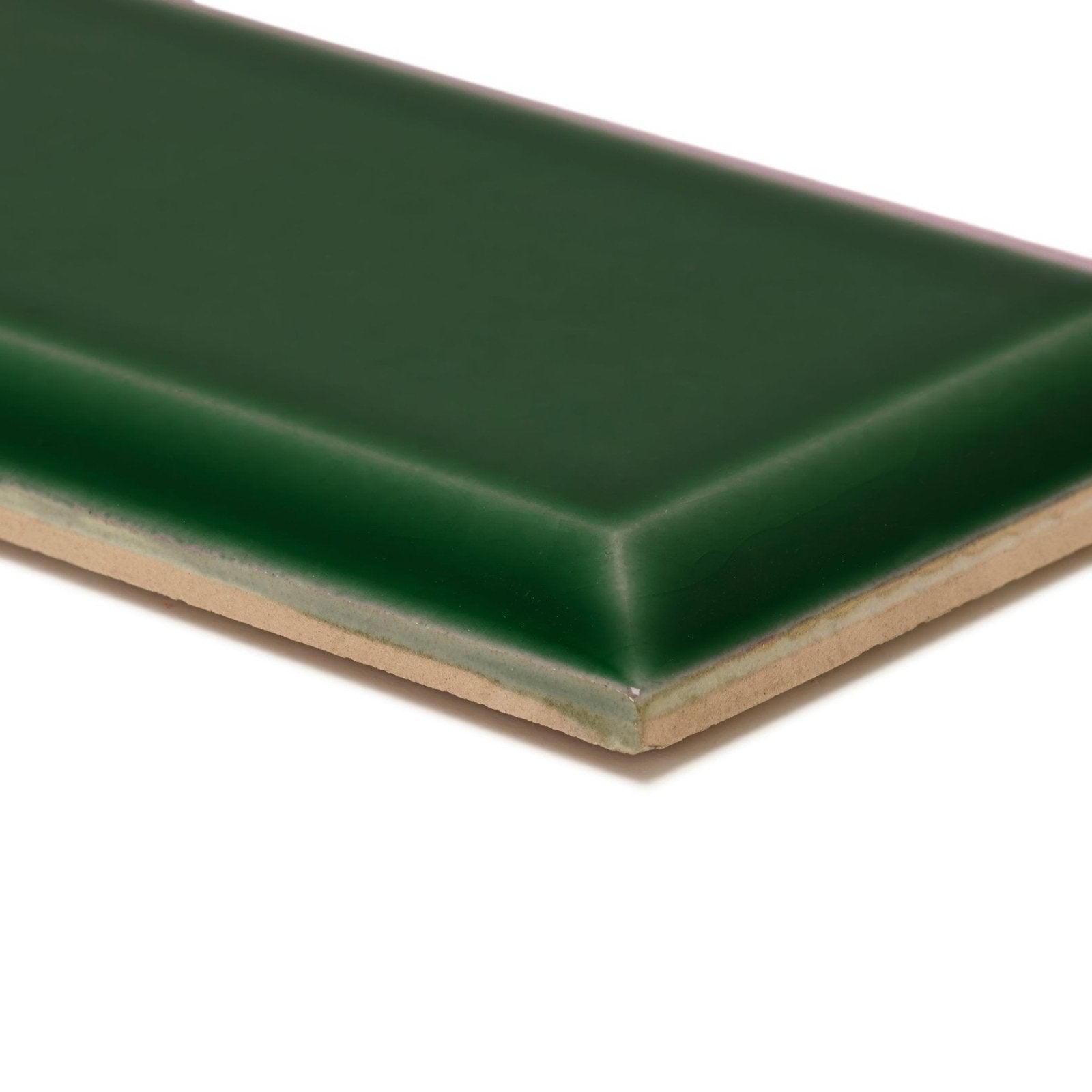 A sleek forest green glazed ceramic metropolitan brompton road metro tile with smooth surface and beige clay edge
