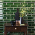 Black matte ceramic pitcher holding delicate yellow flowers complementing metropolitan brompton road glazed metro tile