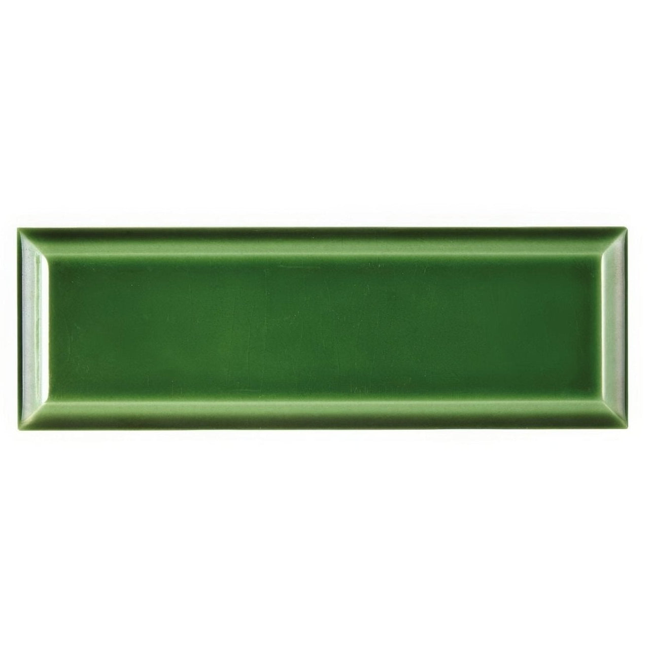 A rectangular glossy forest green ceramic metropolitan brompton road glazed metro tile with a subtle raised border