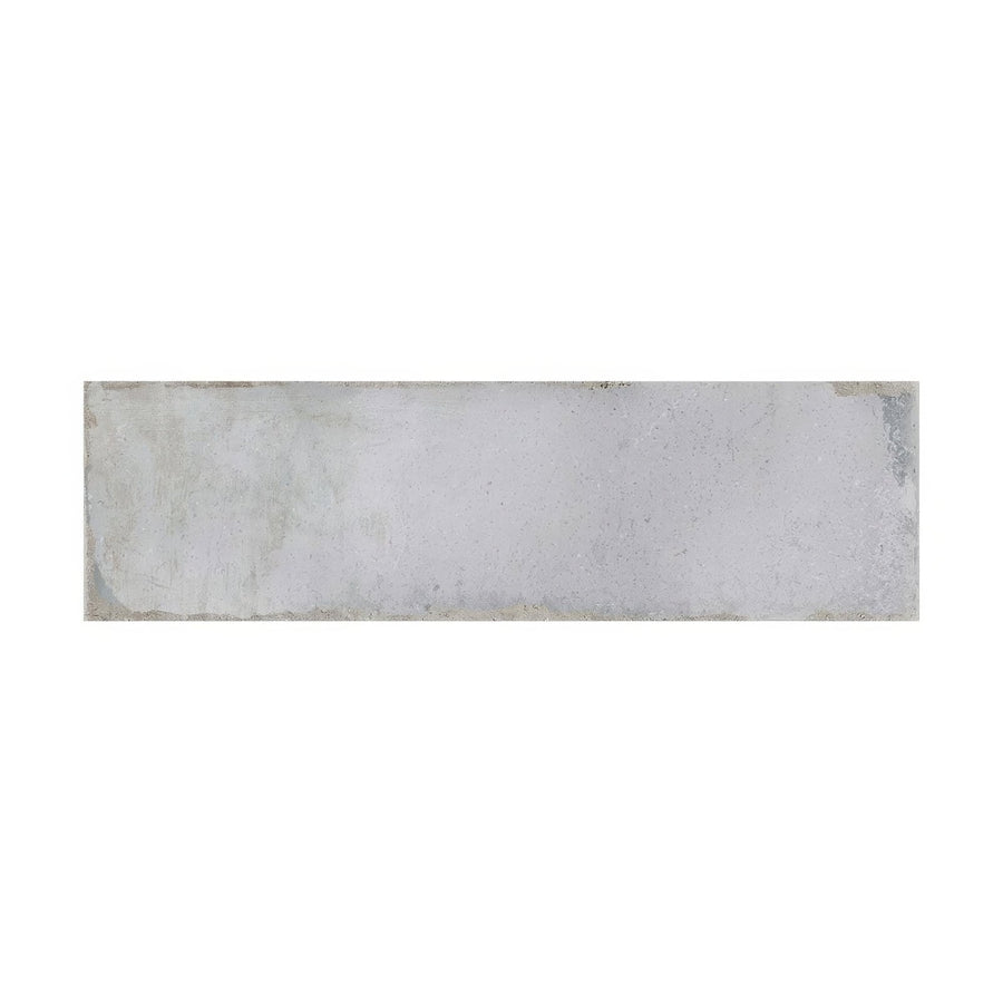 A metropolitan new york rectangular light gray concrete tile with subtle texture and slightly uneven edges