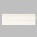 Off-white ceramic metropolitan queensway trim baseboard with smooth glossy finish and subtle curved profile
