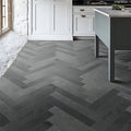 Dark gray metropolitan slate parquet floor tiles with herringbone pattern and matte stone-like riven finish