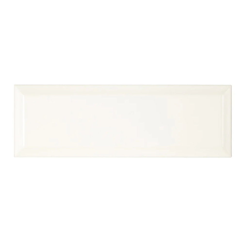 Cream-colored rectangular ceramic tile with a glossy finish metropolitan queensway glazed metro tile