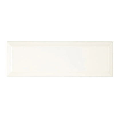 Cream-colored rectangular ceramic tile with a glossy finish metropolitan queensway glazed metro tile