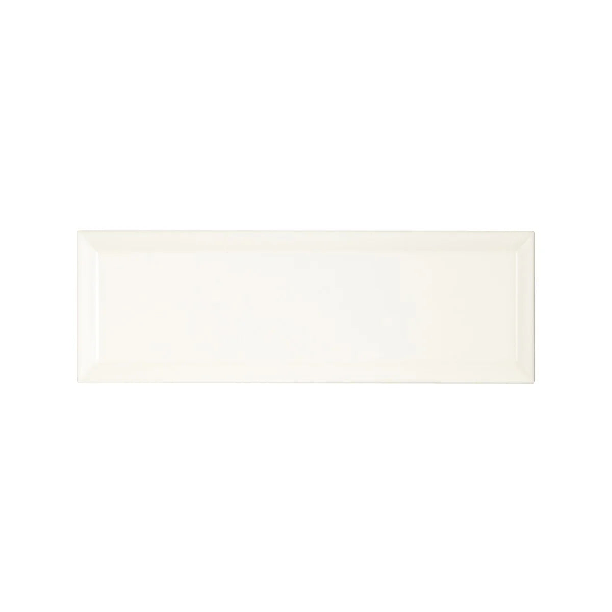 Cream-colored rectangular ceramic tile with a glossy finish from metropolitan queensway glazed metro tile collection