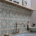 Brass farmhouse-style kitchen faucet mezzo nocturne with ornate spout and cross handles
