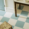 The milan cerva white porcelain tile floor features a checkerboard pattern with light blue and off-white squares