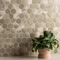 Mimas Gold Mixed Finish Hexagon Mosaic gold hexagonal mosaic with a pink ceramic planter